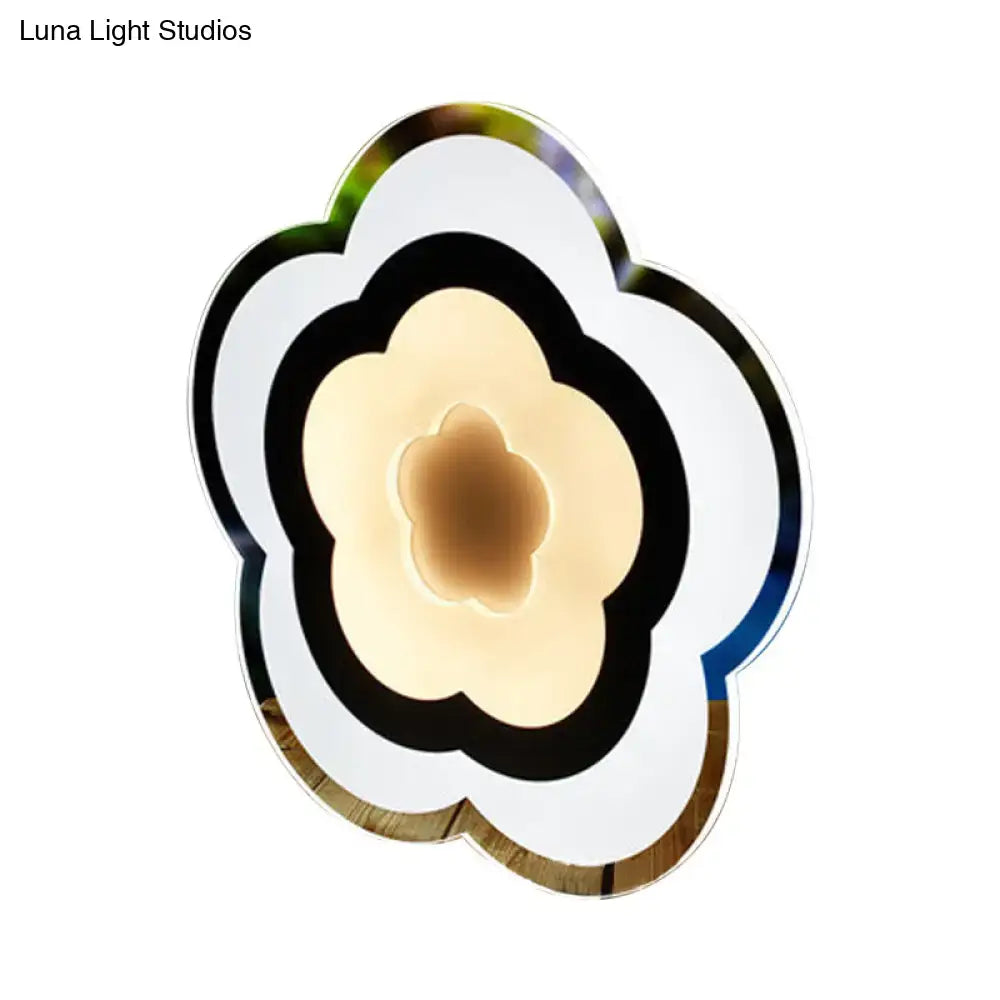 White acrylic LED table lamp in a layered flower design with warm glow Decorbites on Tampa Home & Garden Store