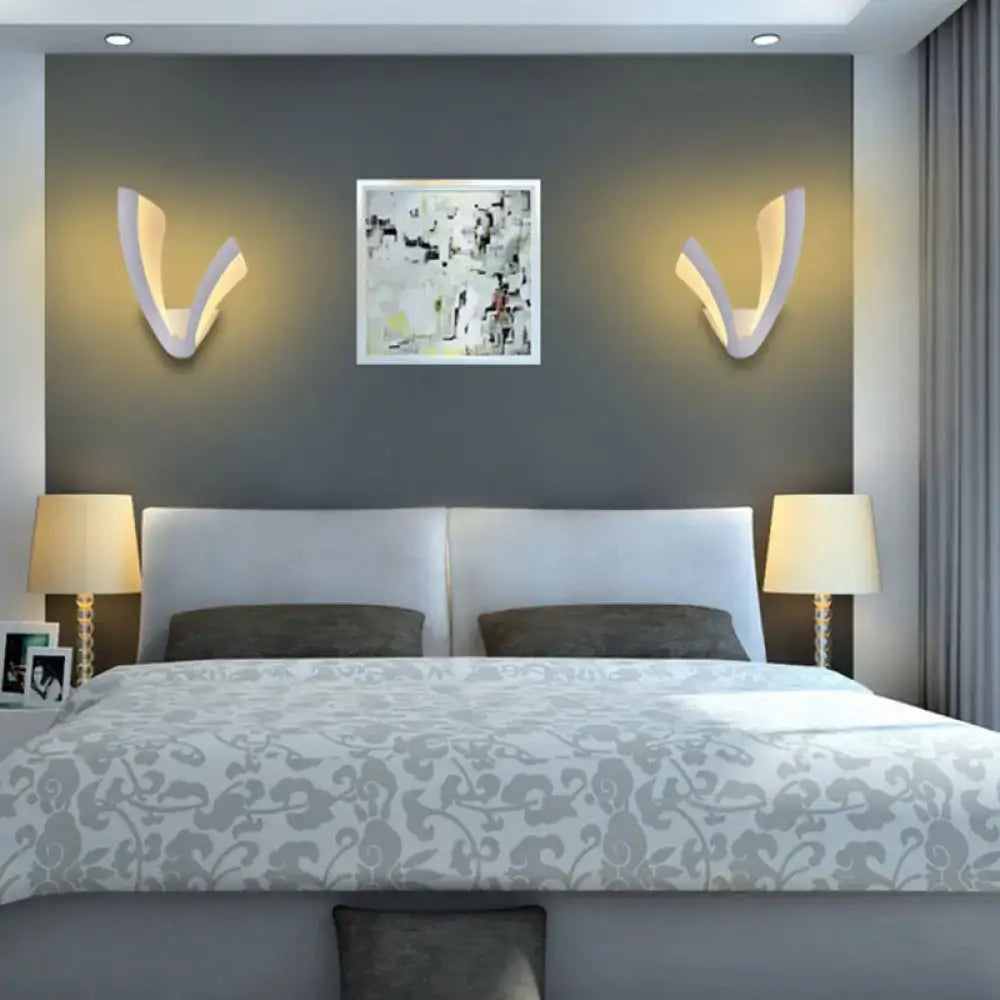 Pair of white acrylic LED table lamps with cream shades on nightstands in a modern bedroom on Tampa Home & Garden Store
