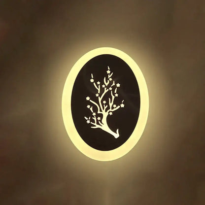 White acrylic LED table lamp Decorbites, circular ring with black tree-cutout and warm glow on Tampa Home & Garden Store