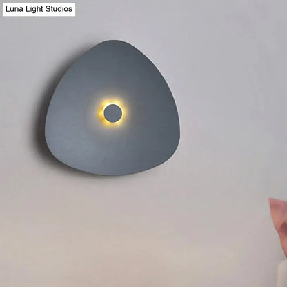 White flaky acrylic sconce with glossy finish, rounded shape and glowing circle Decorbites on Tampa Home & Garden Store