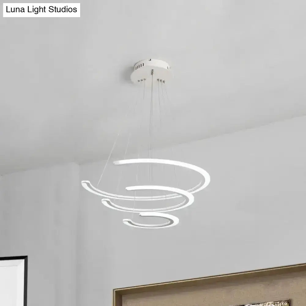 Modern white acrylic LED ring chandelier by Decorbites in dining room with spiraling rings on Tampa Home & Garden Store