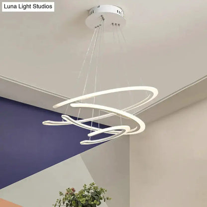 Modern white acrylic LED ring chandelier pendant light with looping sculptural rings on Tampa Home & Garden Store