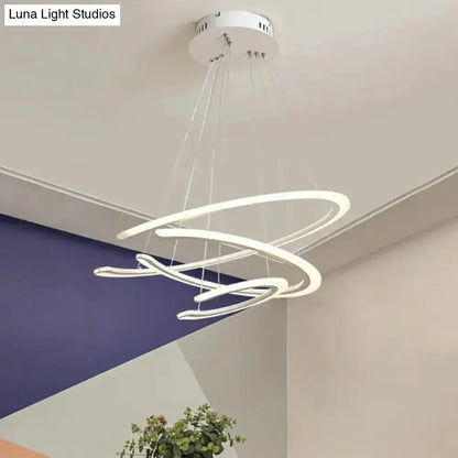 Modern white acrylic LED ring chandelier pendant light with looping rings, suspended by cables Decorbites on Tampa Home & Garden Store