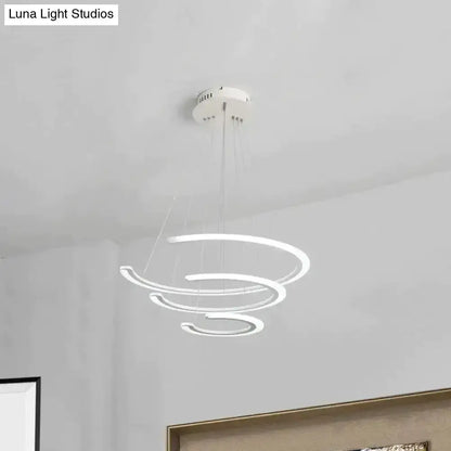 Modern white acrylic LED ring chandelier with glowing spiral rings suspended by thin cables on Tampa Home & Garden Store