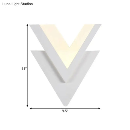 White acrylic LED sconce in a layered chevron V shape with warm glow by Decorbites on Tampa Home & Garden Store