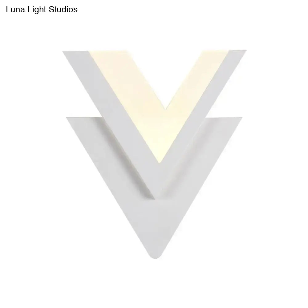 White acrylic LED sconce by Decorbites with stacked V silhouette and warm glow on Tampa Home & Garden Store