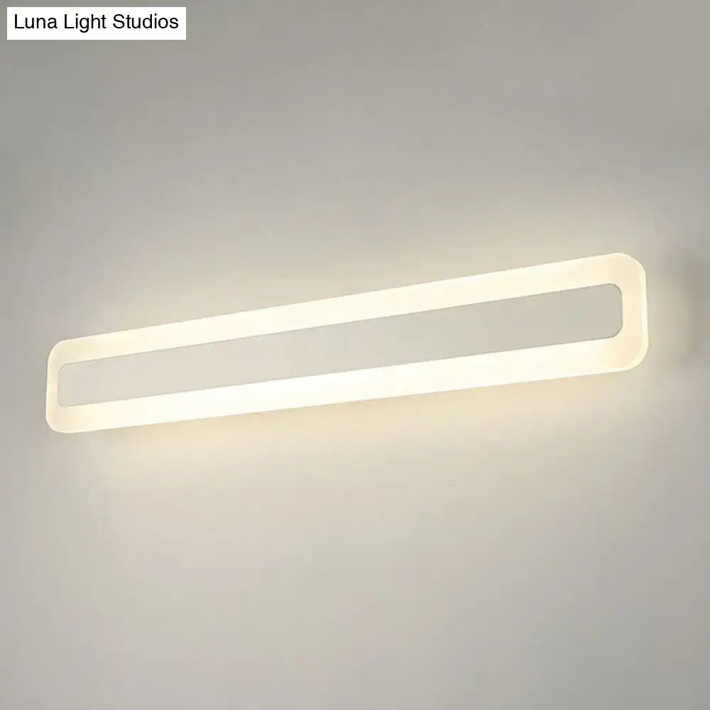 Decorbites white acrylic LED vanity light with slim open rounded-rectangle frame, wall-mounted on Tampa Home & Garden Store