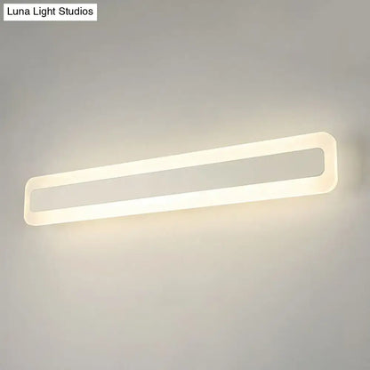 Decorbites white acrylic LED vanity light with slim open rounded-rectangle frame, wall-mounted on Tampa Home & Garden Store