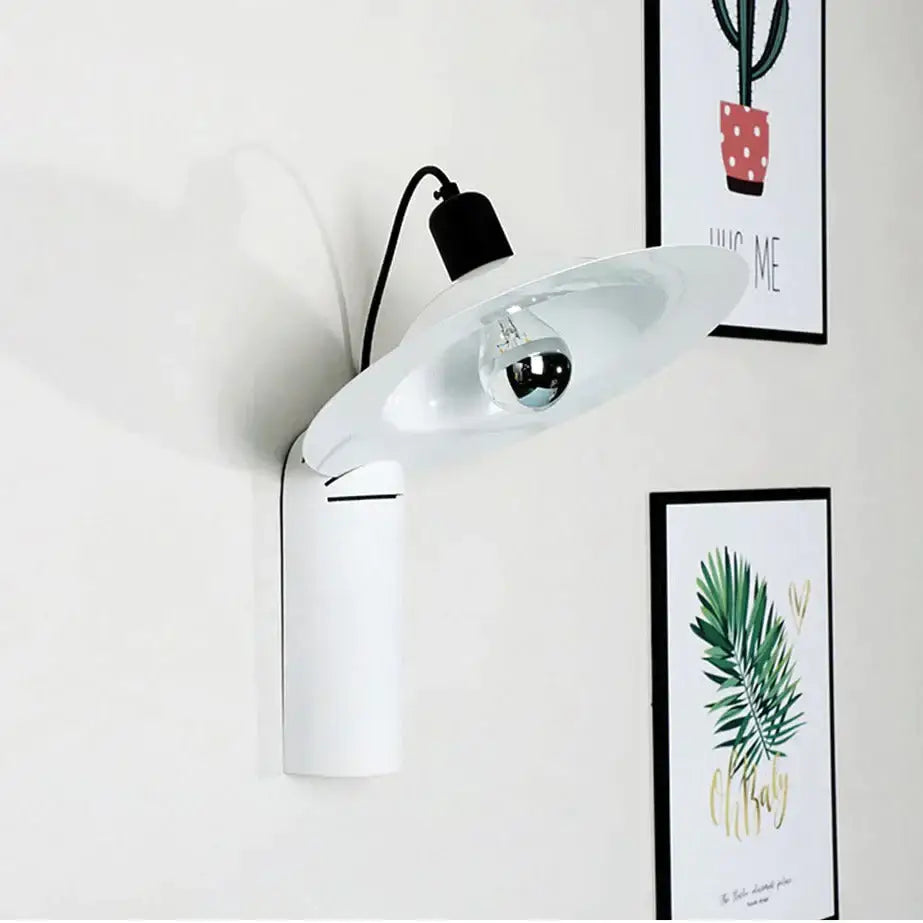 White modern wall sconce by Decorbites with oval shade and black accent on Tampa Home & Garden Store