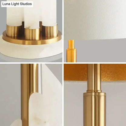 Modern white alabaster drum table lamp by Decorbites with gold brass accents for bedroom bedside on Tampa Home & Garden Store