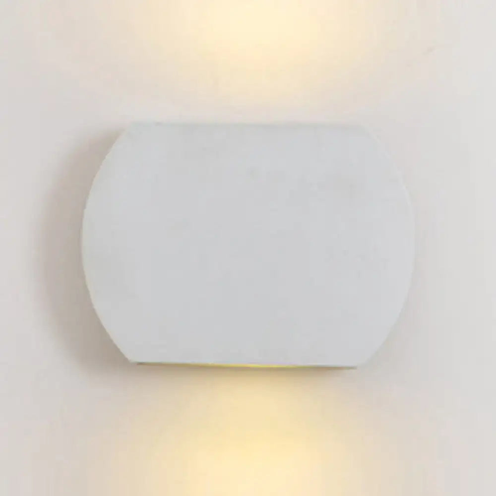 Oval LED Wall Lamp by Decorbites, white matte fixture with warm glow on Tampa Home & Garden Store