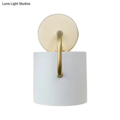 Modern white and gold cylinder wall lamp sconce with round backplate and gold arm Decorbites on Tampa Home & Garden Store