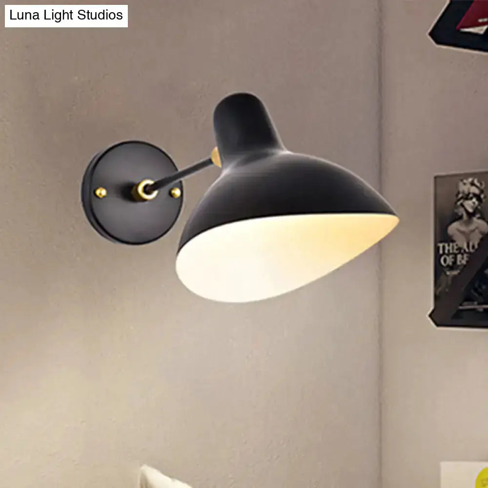 Modern black wall-mounted lamp with adjustable arm, white interior shade and gold accents on Tampa Home & Garden Store