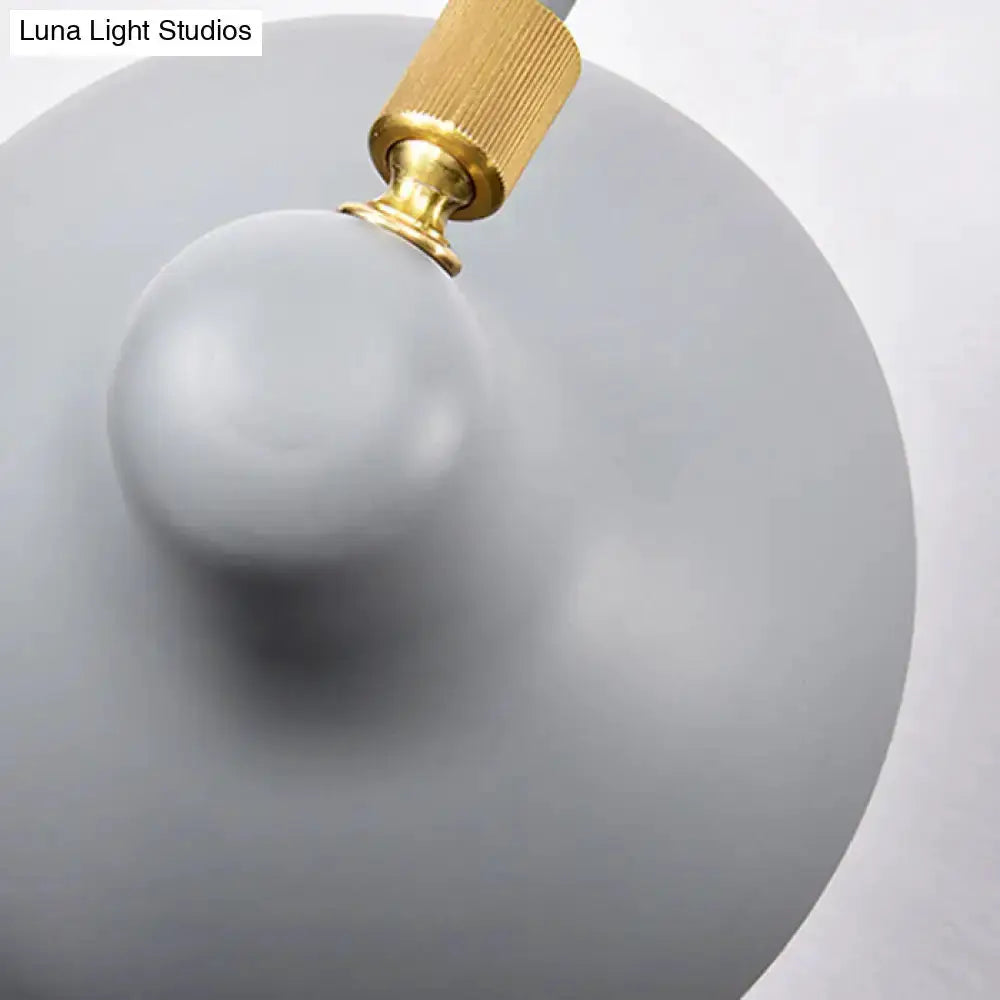 Modern white and gold wall mounted lamp with gray circular backplate and adjustable arm on Tampa Home & Garden Store