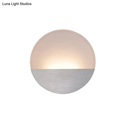 Silver LED sconce light by Decorbites, round two-tone metallic wall fixture with warm glow on Tampa Home & Garden Store