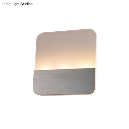 Silver LED sconce light by Decorbites with brushed metal base and frosted panel glow on Tampa Home & Garden Store