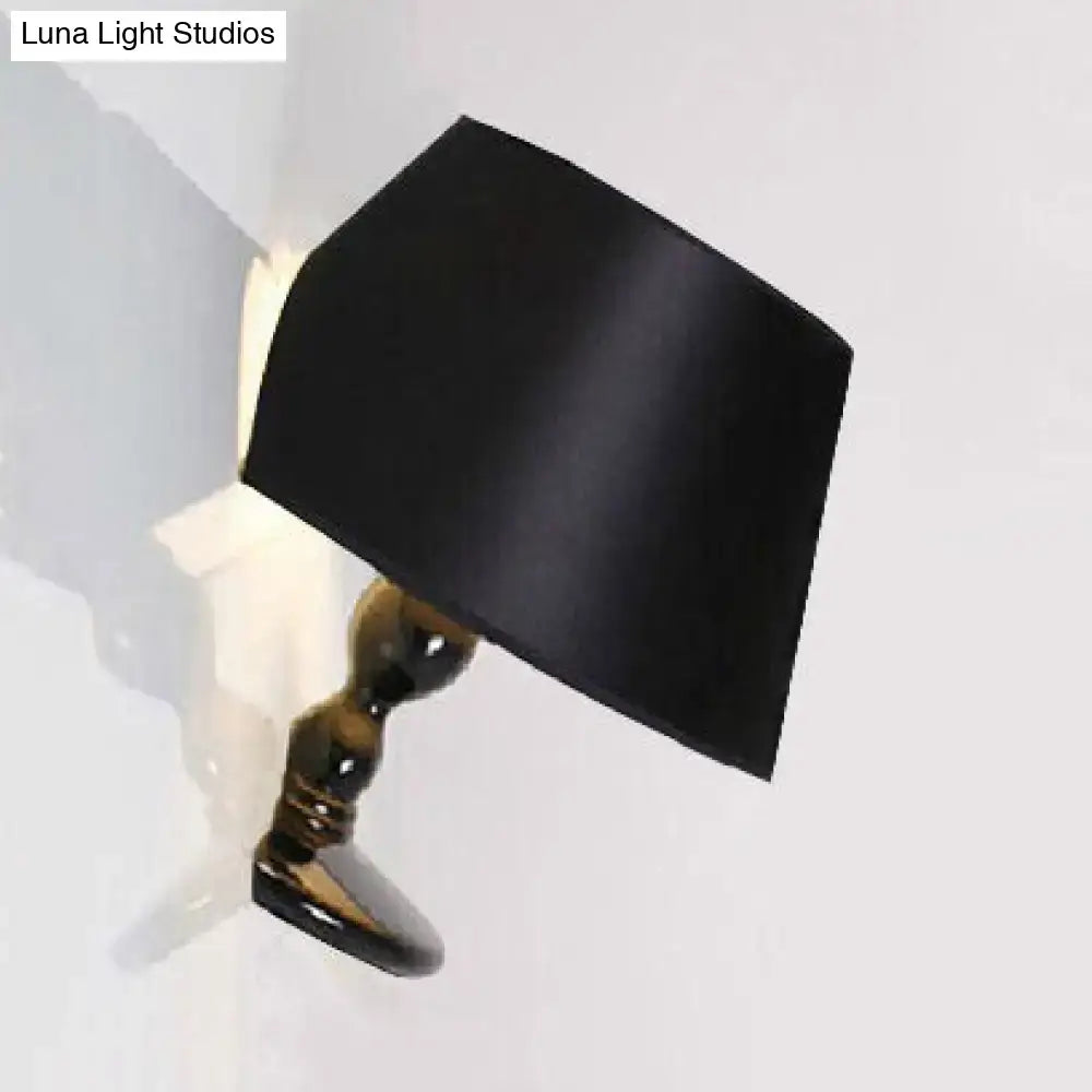 Black cone sconce by Decorbites with brass curved arm wall mounted light fixture on Tampa Home & Garden Store
