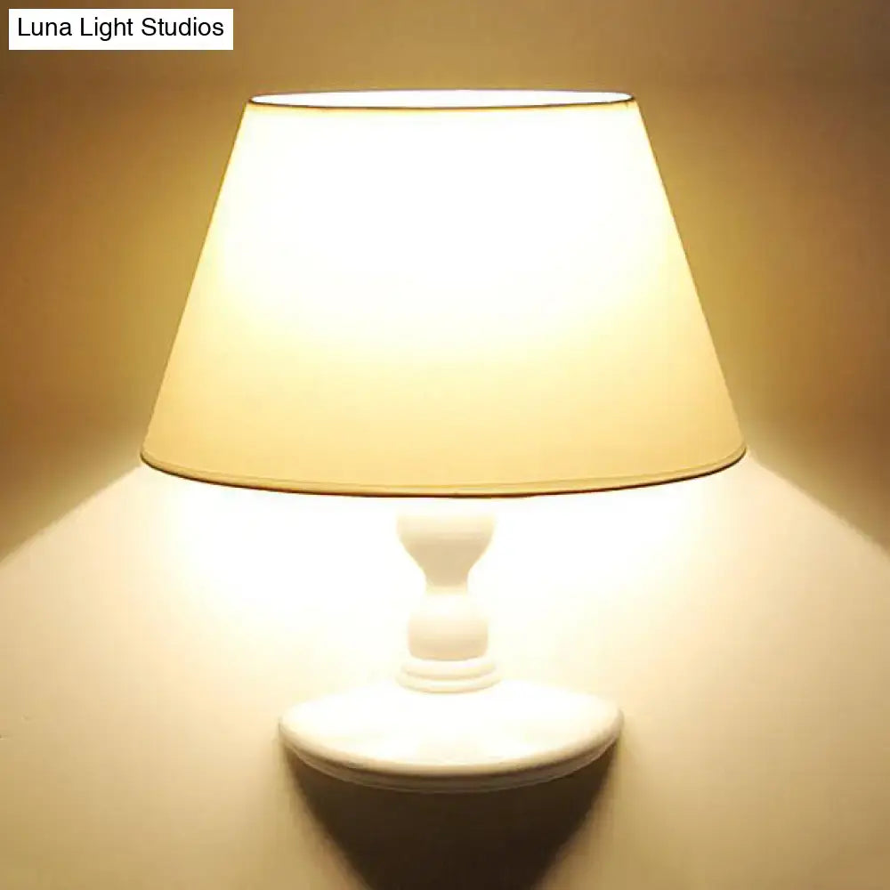 White cone shade wall sconce with ceramic base on Tampa Home & Garden Store