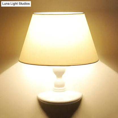White cone shade wall sconce with ceramic base on Tampa Home & Garden Store