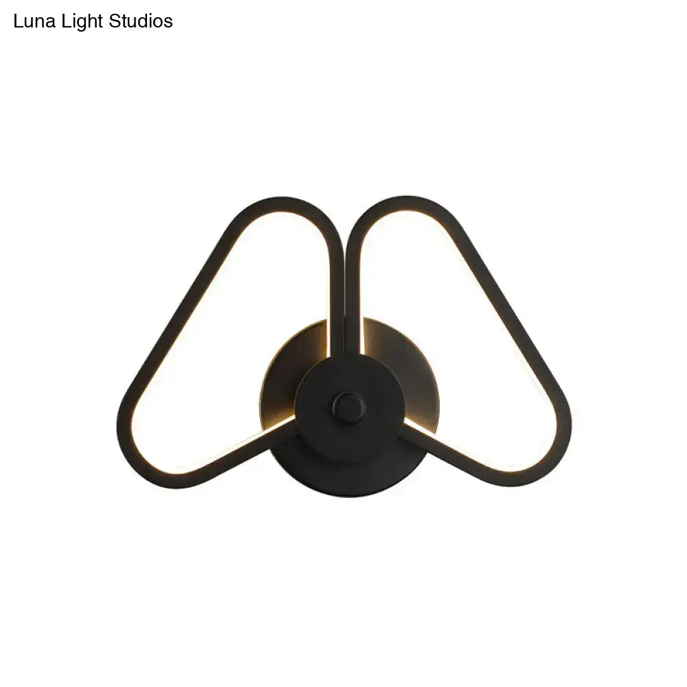 Black triangle wall sconce with dual illuminated frames, metal finish, Decorbites on Tampa Home & Garden Store
