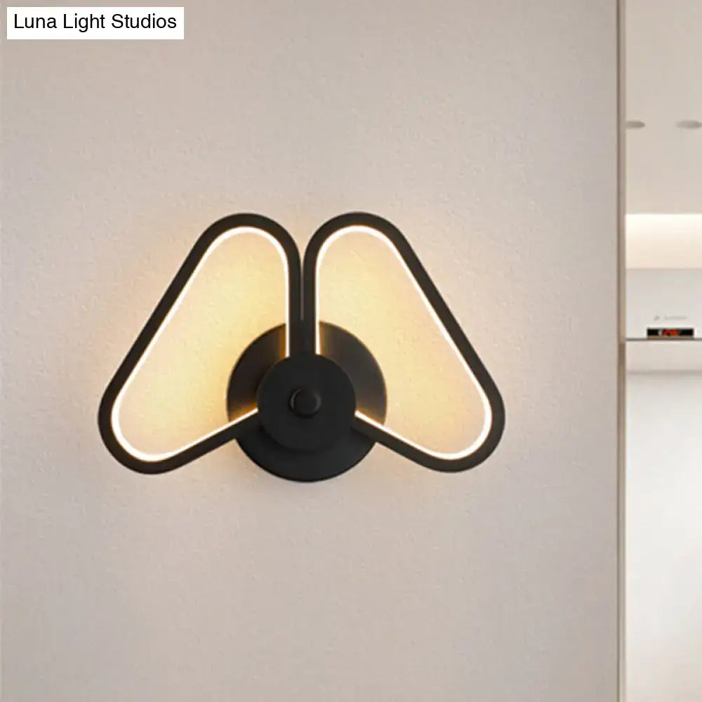 Decorbites black triangle wall sconce with triangle frame and warm glow Luna watermark on Tampa Home & Garden Store