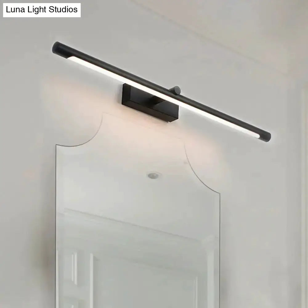 Modern white & black tube vanity lighting bathroom wall sconce mounted above mirror on Tampa Home & Garden Store
