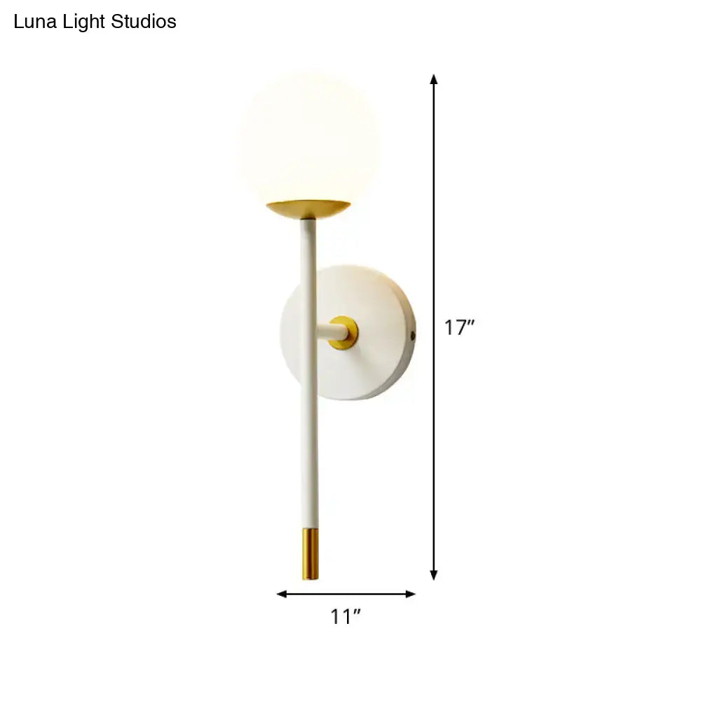 Brass Frosted Long-Arm Wall Sconce with frosted globe and white stem by Decorbites, 17in tall, 11in wide on Tampa Home & Garden Store