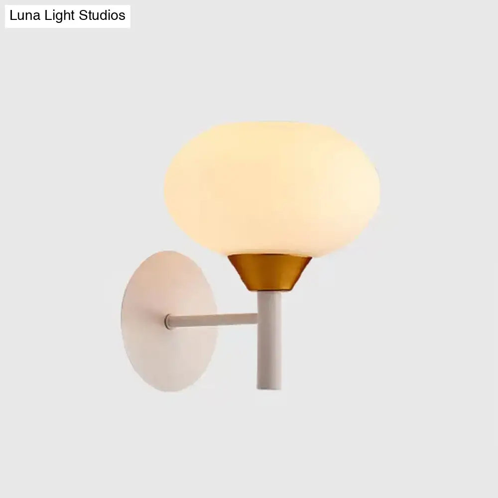 Brass opal glass minimalist wall sconce with frosted shade and circular backplate on Tampa Home & Garden Store