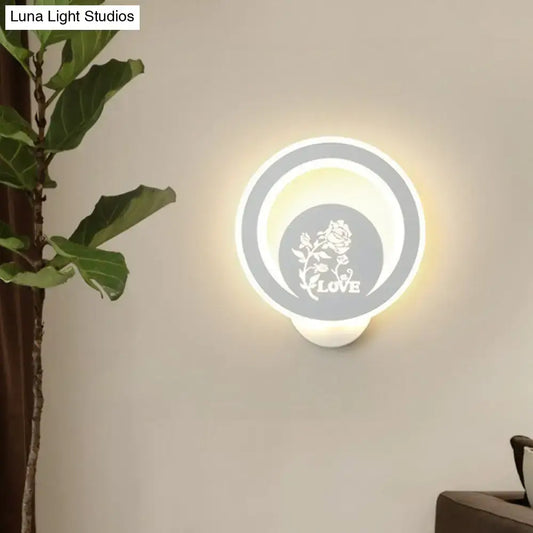 Modern white circular LED wall light with floral LOVE motif; Decorbites, Luna Light Studios on Tampa Home & Garden Store