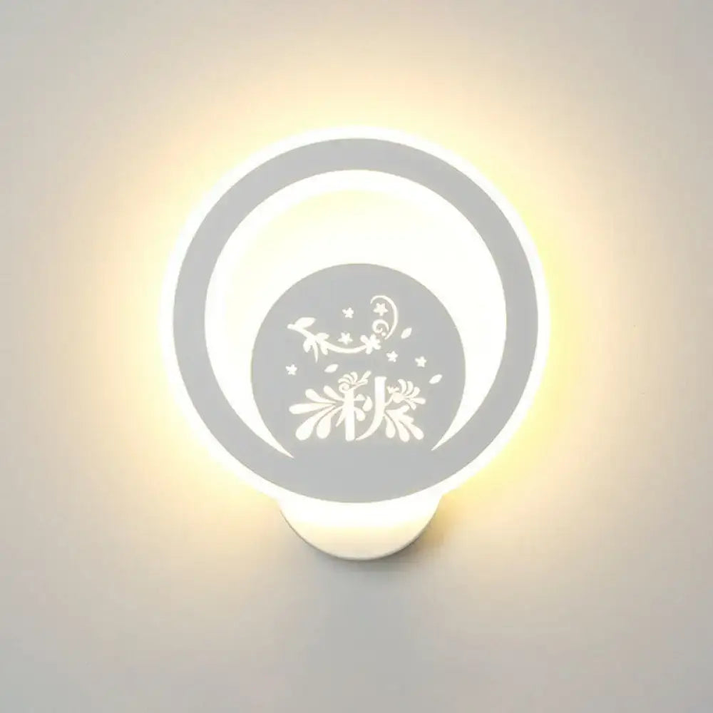 White round LED wall light by Decorbites with decorative cutout pattern and warm bedroom glow on Tampa Home & Garden Store