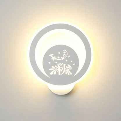 White round LED wall light by Decorbites with decorative cutout pattern and warm bedroom glow on Tampa Home & Garden Store