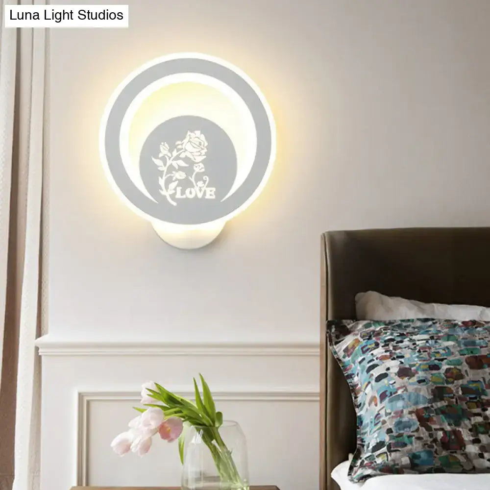 Modern white circular LED wall light with floral LOVE cutout, warm glow by Luna Light Studios on Tampa Home & Garden Store