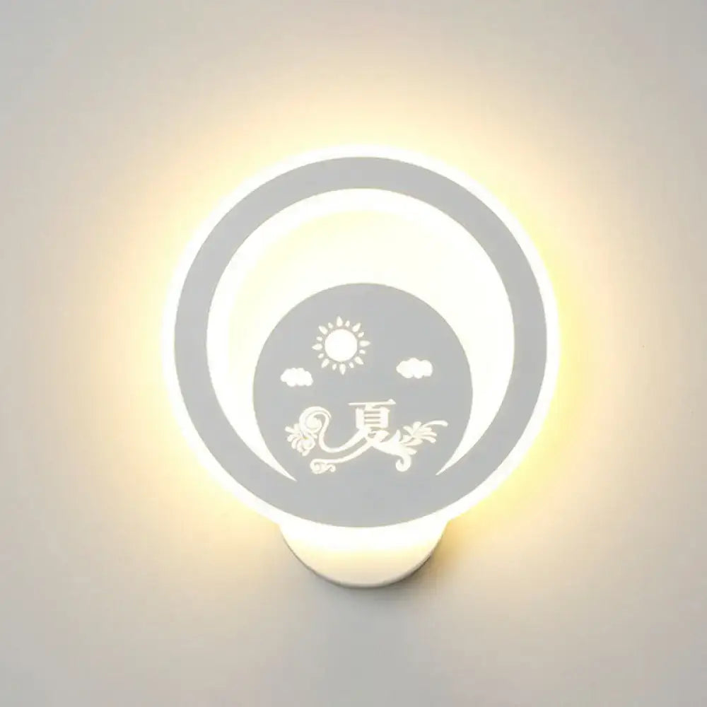 Round white LED wall light fixture featuring inner sun and clouds with floral motif on Tampa Home & Garden Store