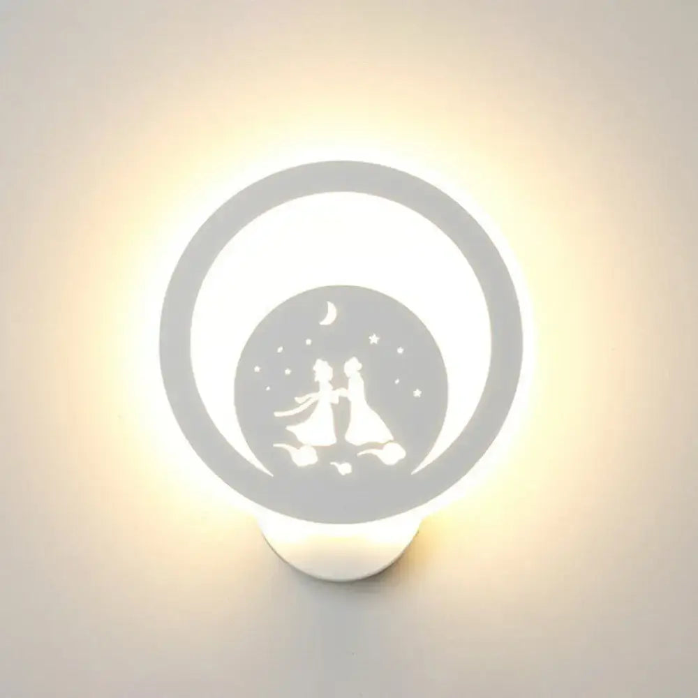 White circular LED wall light fixture with silhouette of a couple under moon and stars on Tampa Home & Garden Store