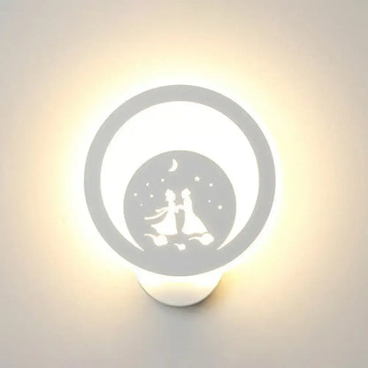 White circular LED wall light fixture with silhouette of a couple under moon and stars on Tampa Home & Garden Store