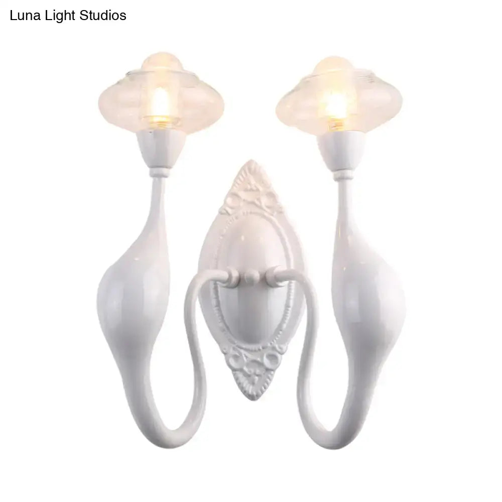 White ceramic wall sconce with backplate and curved arms, two glass shades by Decorbites on Tampa Home & Garden Store