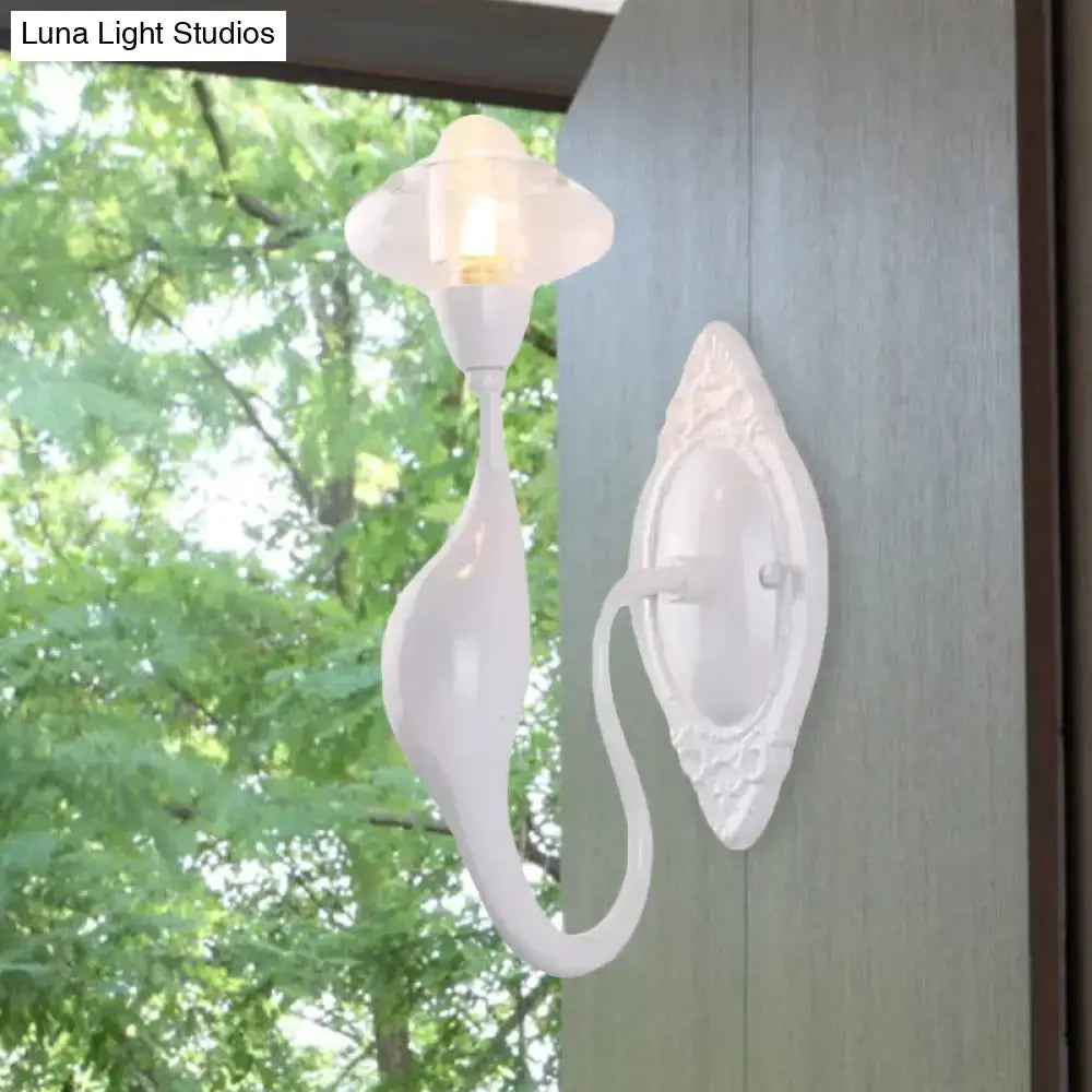White ceramic wall sconce with curved arm and ornate backplate by Decorbites on Tampa Home & Garden Store