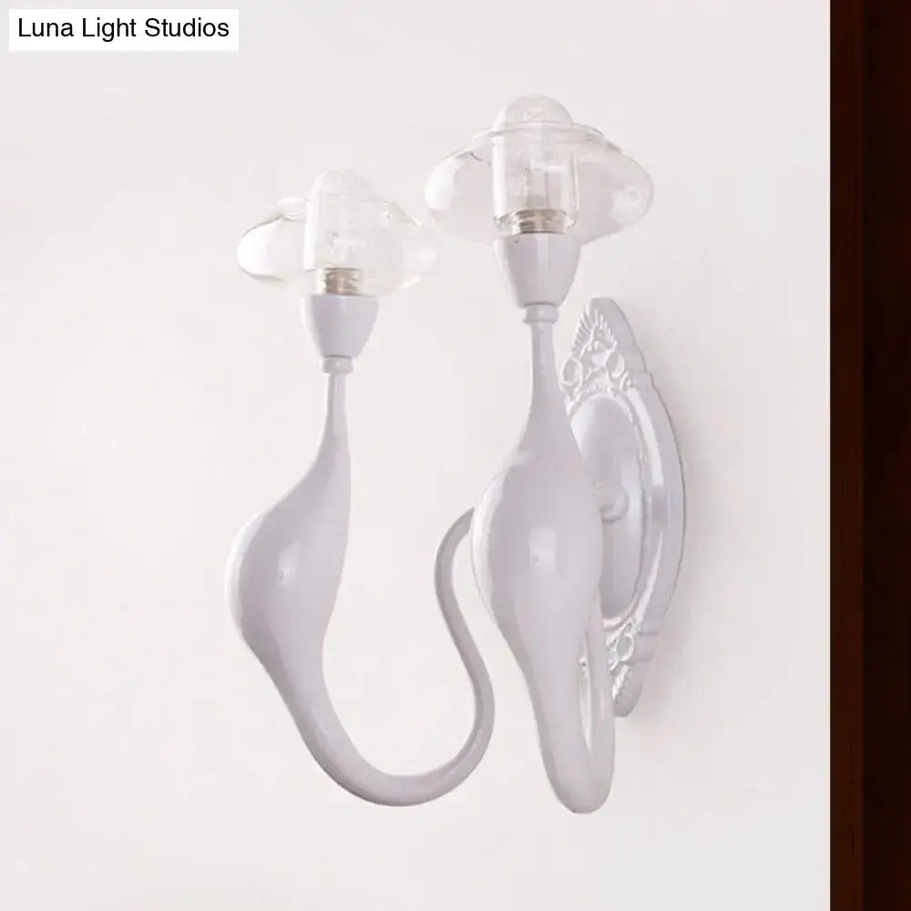 White ceramic wall sconce with dual curved arms and clear glass candle shades on Tampa Home & Garden Store