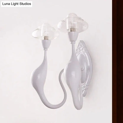 White ceramic wall sconce with dual curved arms and clear glass candle shades on Tampa Home & Garden Store