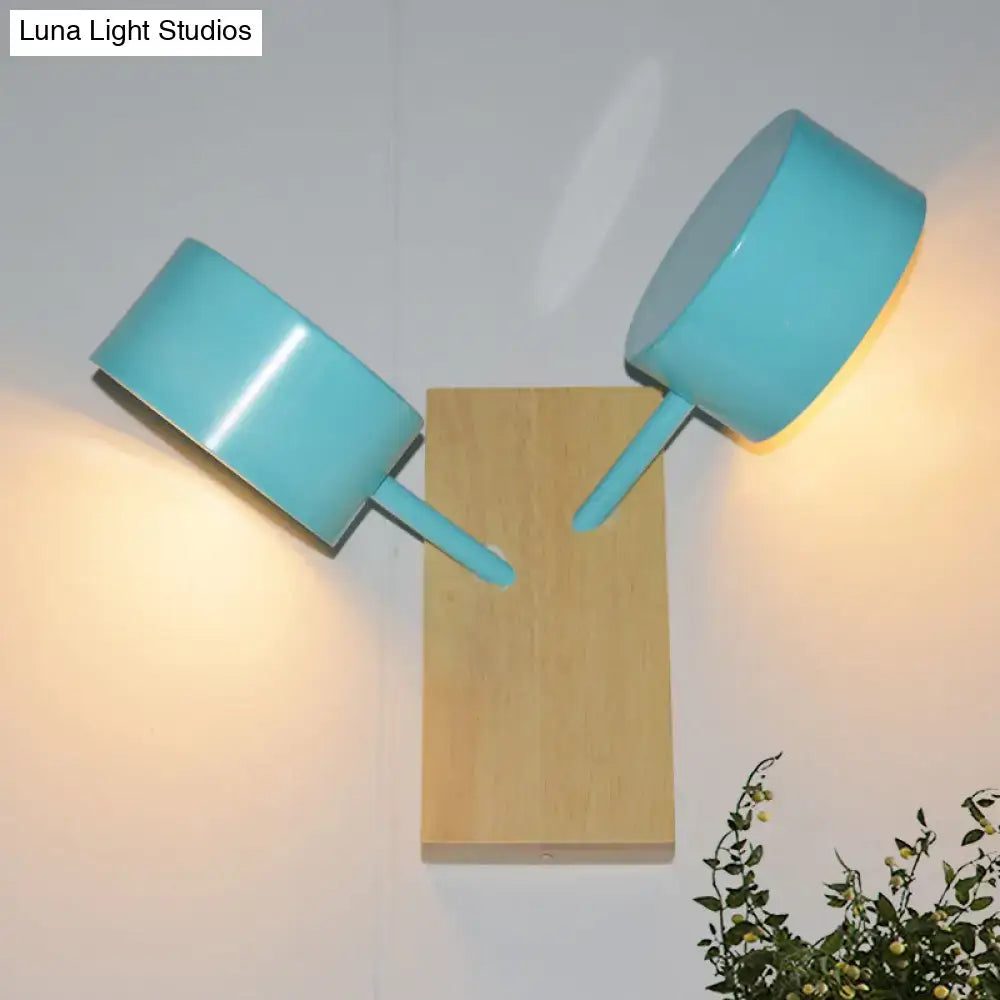 Turquoise ceramic drum sconces on a wood backplate pair on Tampa Home & Garden Store
