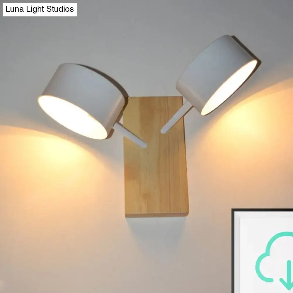 White ceramic drum double-light wall sconce on wooden backplate by Decorbites on Tampa Home & Garden Store