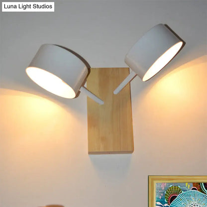 White ceramic drum sconce with wood backplate and dual white arms, Decorbites wall light on Tampa Home & Garden Store