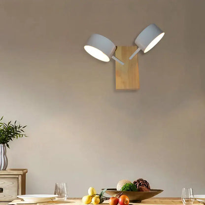 White ceramic drum wall sconce with twin shades on a wooden backplate, living room lighting on Tampa Home & Garden Store