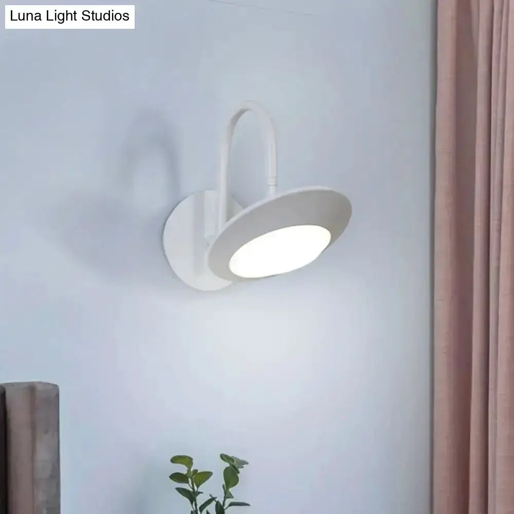Rotatable white LED wall sconce with curved arm and circular shade by Decorbites on Tampa Home & Garden Store