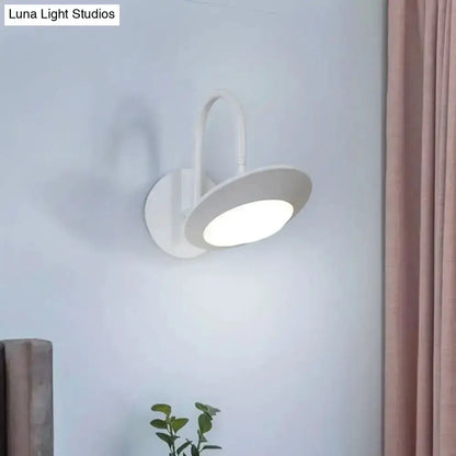 Rotatable white LED wall sconce with curved arm and circular shade by Decorbites on Tampa Home & Garden Store