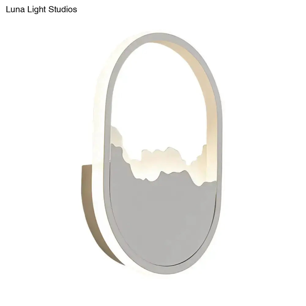 Decorbites oval sconce lamp with white cracked design and soft backlit glow for stair lighting on Tampa Home & Garden Store