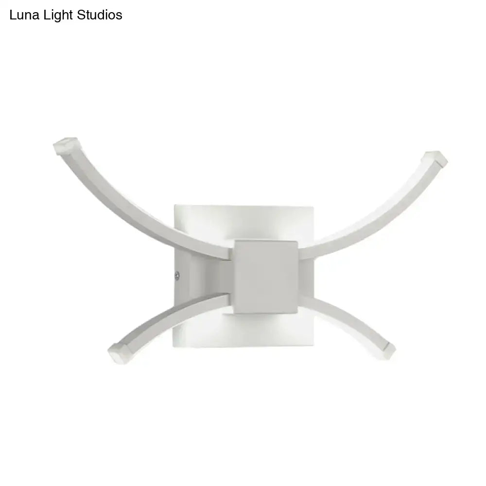 Decorbites white metal LED wall sconce with four curved arms around a square base on Tampa Home & Garden Store