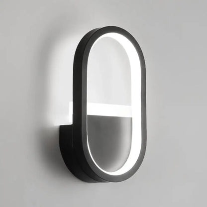 White elliptical LED wall sconce by Decorbites, black frame with illuminated inner ring on Tampa Home & Garden Store