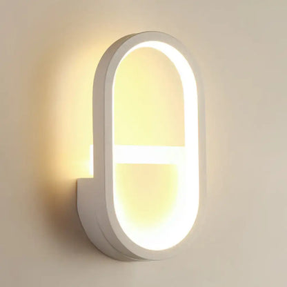 White elliptical LED wall sconce by Decorbites with integrated warm glow on Tampa Home & Garden Store