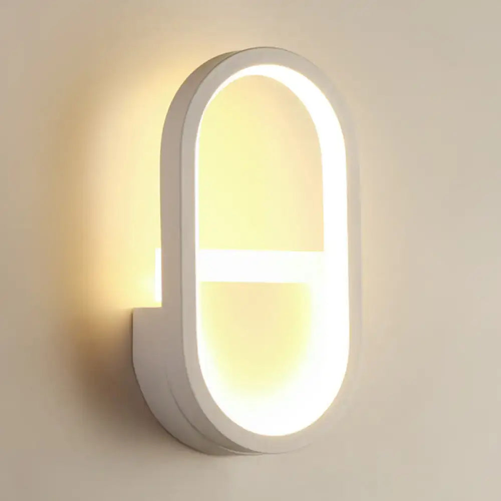 White Elliptical LED Wall Sconce by Decorbites with glowing oval frame on Tampa Home & Garden Store